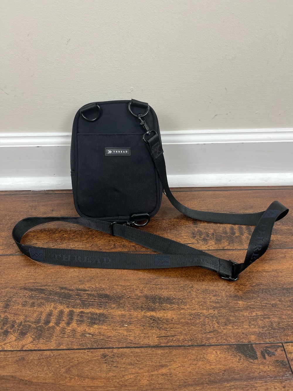 Thread Black Small Crossbody Bag Zip Closure Adjustable Strap Inner Pockets.